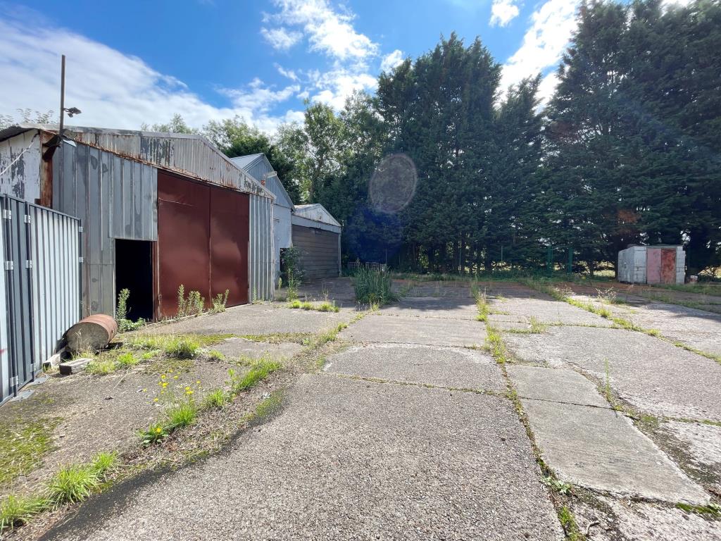 Lot: 133 - COMMERCIAL PROPERTY AND YARD WITH PLANNING - View of yard and entrance to the lock up units